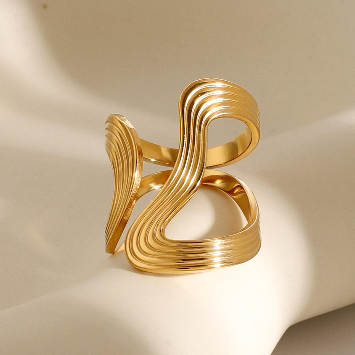 Gold Ridged Wave Loop Statement Ring