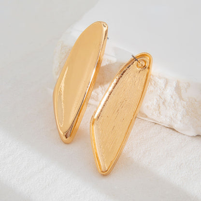 Gold Oversized Leaf Blade Statement Earrings