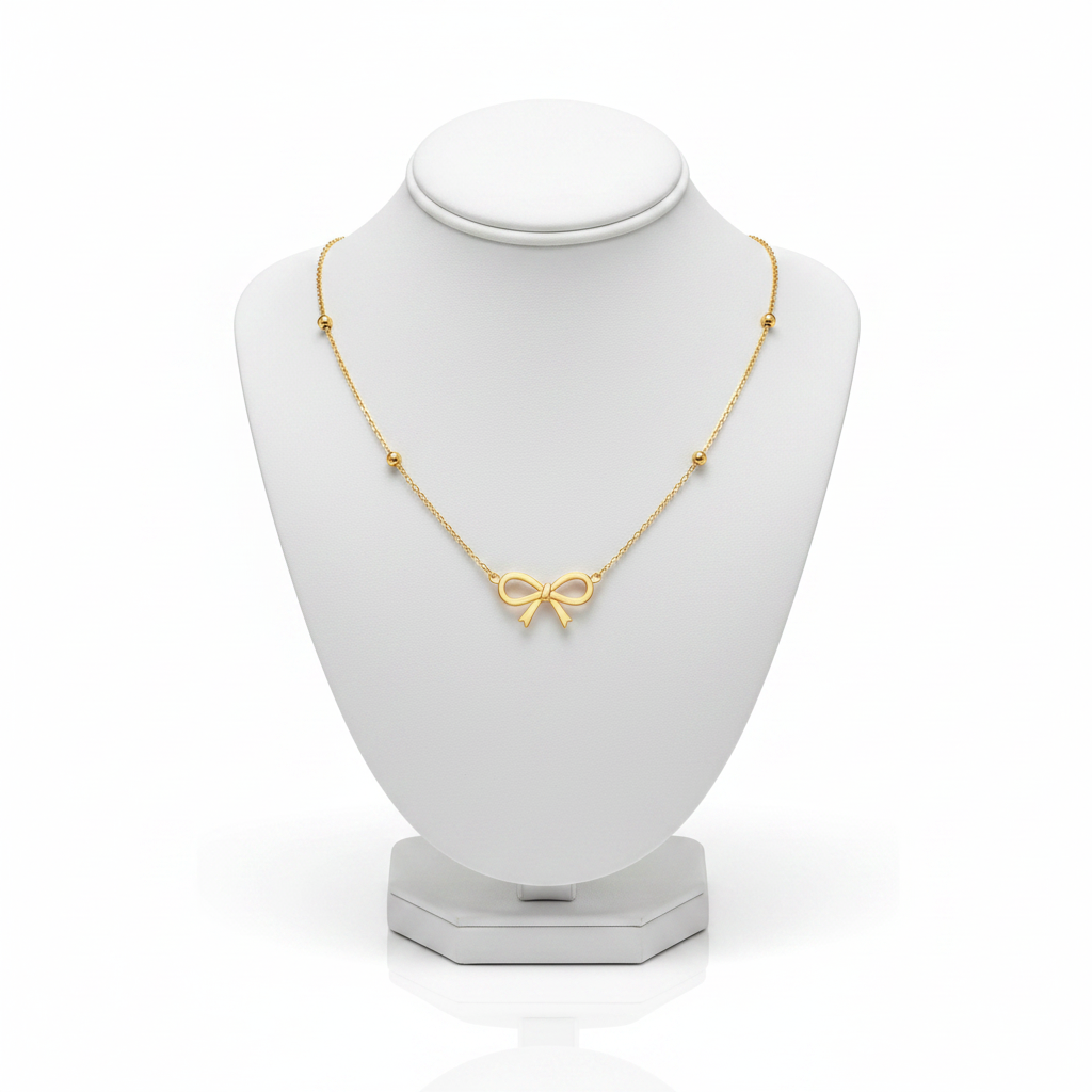 Gold Bow Pendant Necklace on White Mannequin