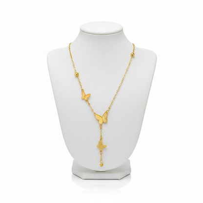 Gold Triple Butterfly Lariat Necklace on White Mannequin